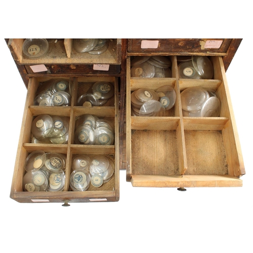 212 - Twelve drawer wooden chest containing a quantity of assorted watch glasses of various sizes, 27.5'' ... 