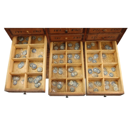 219 - Twelve drawer wooden chest containing a quantity of assorted watch glasses of various sizes, 27.25''... 