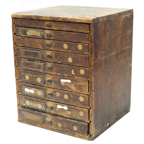 396 - Nine drawer wooden chest containing a quantity of watch parts to include balance staffs, balances an... 