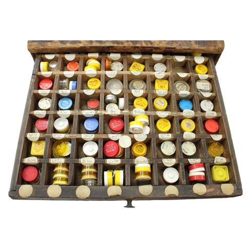 396 - Nine drawer wooden chest containing a quantity of watch parts to include balance staffs, balances an... 