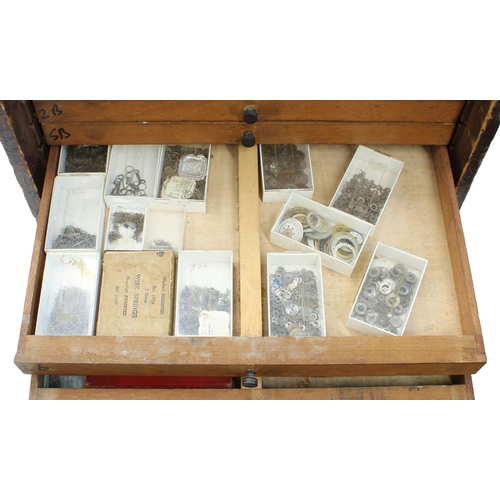 397 - Twelve drawer wooden chest containing a quantity of watch parts including balances, stems, wheels, d... 