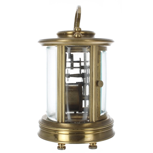 1253 - Carriage clock timepiece, within a circular bevelled glazed brass case, 6.75