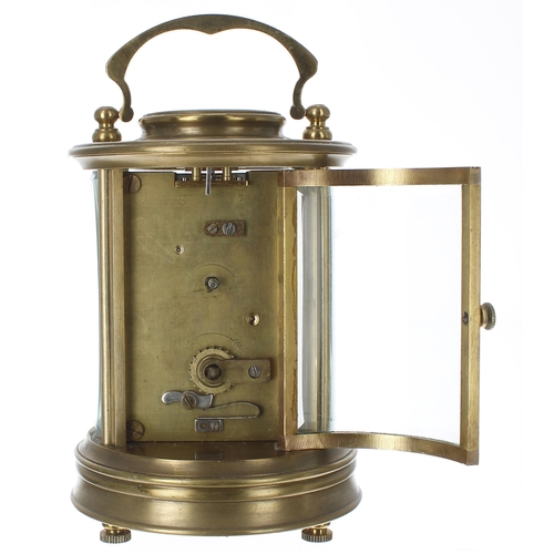 1253 - Carriage clock timepiece, within a circular bevelled glazed brass case, 6.75