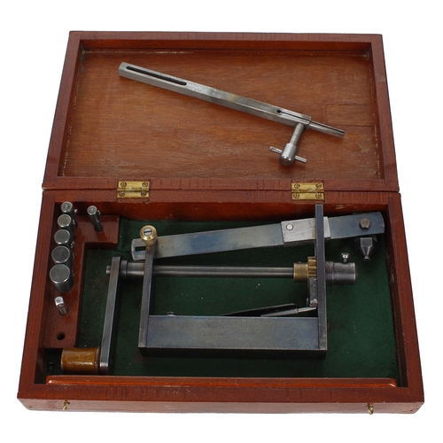 2114 - Clock mainspring winder made after a design by John Wilding, within a fitted mahogany box with attac... 