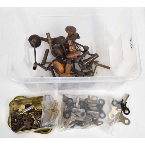 2110 - Ten various crank clock keys with turned wooden handles; also various other clock keys... 