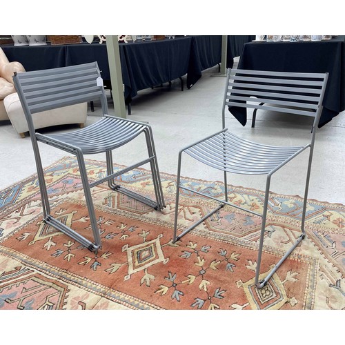 Four EMU 'Aero' painted steel dining chairs, stackable, a Paul Newman design, labelled, in grey, 16" wide, 15" deep, the seats 19" high, the backs 30" high (4)