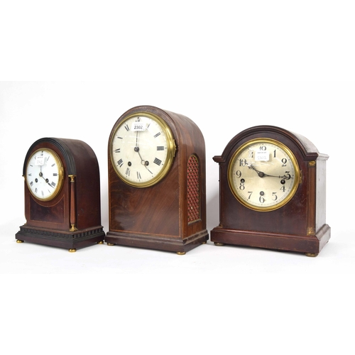 2302 - French mahogany two train mantel clock striking on a gong, within a rounded arched inlaid case, 13.2... 