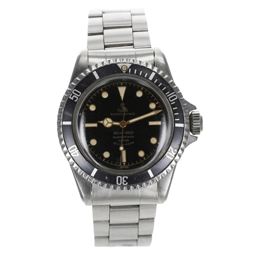 Rare Tudor Oyster-Prince Submariner stainless steel gentleman's wristwatch with 'Cornino' case, reference no. 7928, serial no. 364xxx, circa 1962, black bi-rotational bezel, exclamation 'Swiss' black dial marked '200m=660ft Submariner' Rotor Self-Winding' with dot and baton markers, gilt minute track and sweep centre seconds, Mercedes style hands, 17 jewel Auto-Prince movement, pointed 'Cornino' crown guard case, the inside case back dated 'II.61', rivetted Oyster 7836 bracelet with 380 end links, the bezel 40mm diameter
