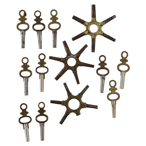 1065 - Two spider pocket watch keys; together with a part spider pocket watch key and ten pocket watch keys... 