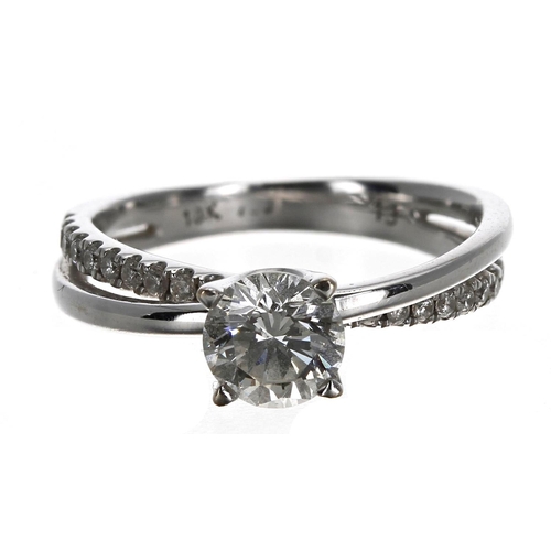 165 - Modern 18ct white gold solitaire diamond crossover design ring, round brilliant-cut, 0.65ct approx, ... 