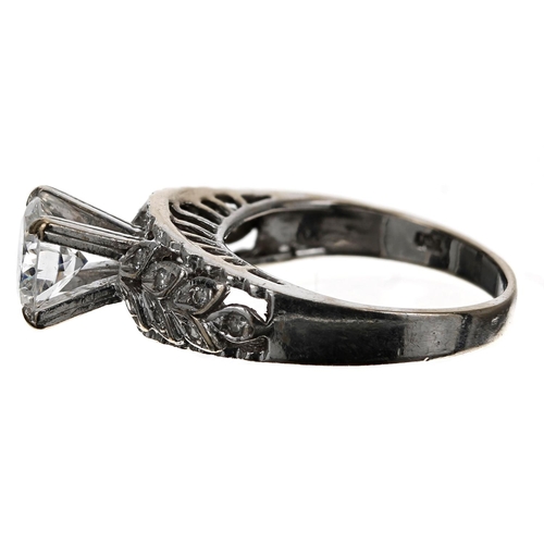 71 - Impressive 18ct white gold brilliant-cut diamond ring with fancy diamond leaf shoulders, the centre ... 