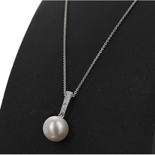 70 - 9ct white gold round freshwater pearl and diamond pendant on a 9ct white gold chain, diamonds 0.07ct... 