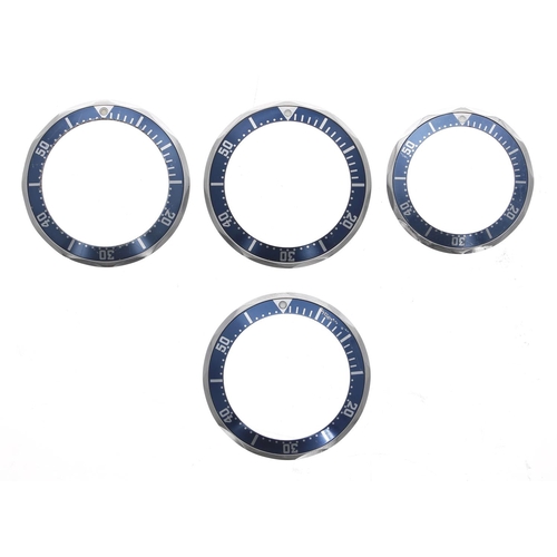 807 - Omega - Four bezels with blue inserts