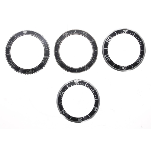 809 - Omega - Four bezels with black inserts