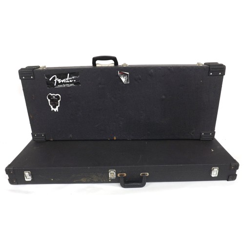 1402 - BC Rich Warlock type electric guitar hard case; together with a generic oblong electric guitar hard ... 