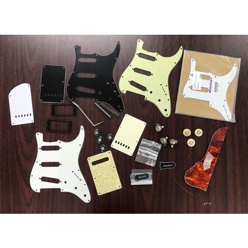 1432 - Selection of pickguard and other guitar plastics to include a late 1970s Fender Stratocaster scratch... 