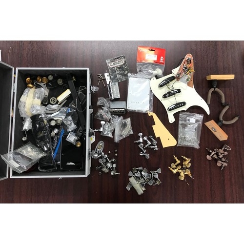 1427 - Selection of guitar spares to include a set of Grover 18-1 tuners, further tuners, two wall hangers,... 