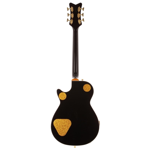 618 - 2011 Gretsch Black Penguin G6134B electric guitar, made in Japan; Body: black gloss finish with oran... 