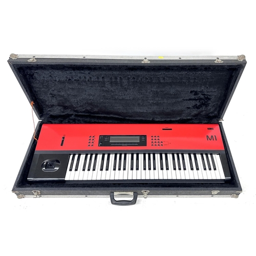 3026 - Korg M1 synthesizer keyboard, made in Japan, ser. no. 903773, with later red vinyl wrap, within heav... 