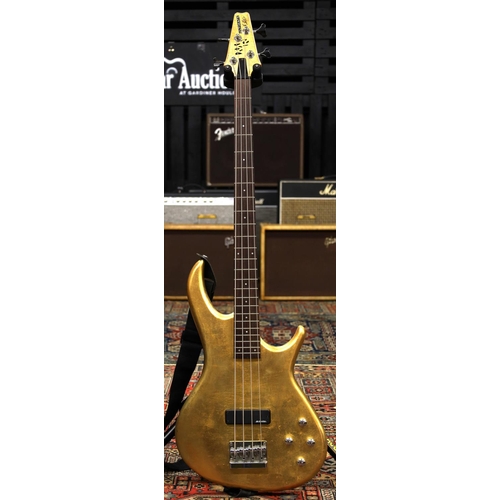 843 - Modified 2002 Aria four string bass guitar with gold leaf applied finish to body and head... 