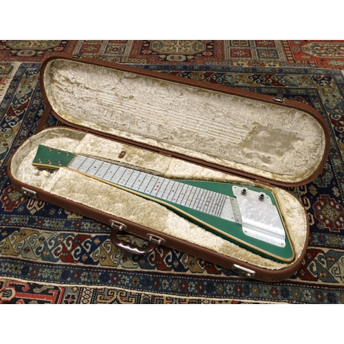 854 - Interesting 1960s lap guitar, green finish with pearloid position board and string cover, within ori... 