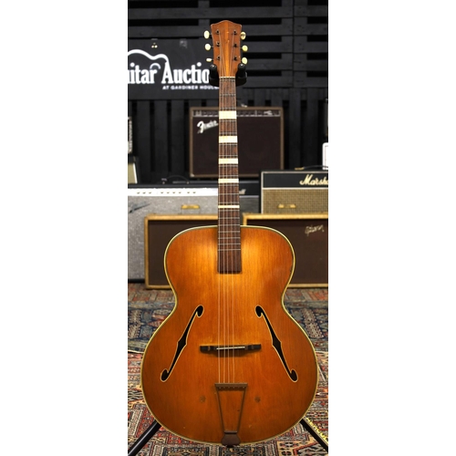 913 - 1950s Olympic archtop guitar; Body: natural finish maple back and sides and spruce top, checking thr... 