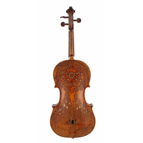 2087 - Late 19th century decorative violin labelled Tom.Carcasso..., the back carved with a castle and moat... 