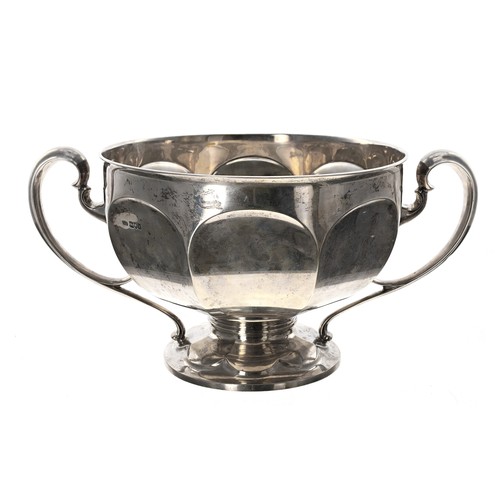 530 - Large Edwardian silver twin-handled trophy, the octagon faceted bowl with two scroll handles raised ... 