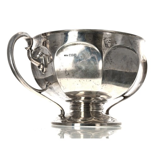 530 - Large Edwardian silver twin-handled trophy, the octagon faceted bowl with two scroll handles raised ... 