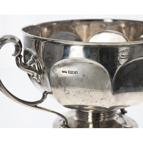 530 - Large Edwardian silver twin-handled trophy, the octagon faceted bowl with two scroll handles raised ... 