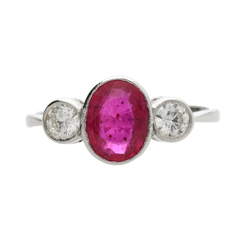 102 - Attractive modern platinum diamond and glass-filled ruby three stone ring, the oval centre stone wit... 