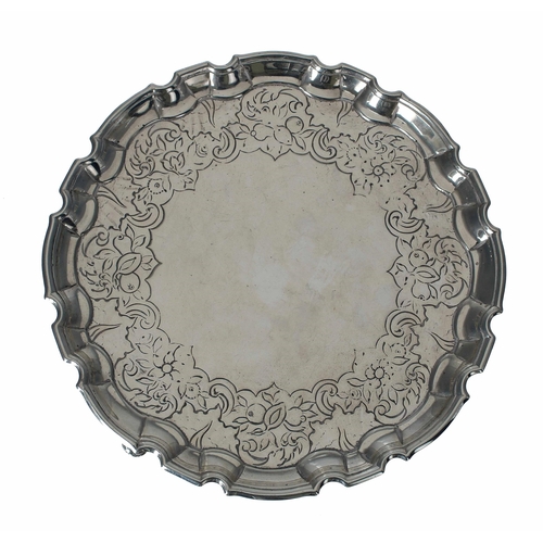 548 - George II Scottish circular silver card tray, with shallow chased foliate and fruits border within a... 