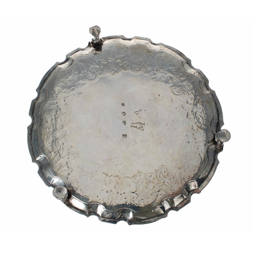 548 - George II Scottish circular silver card tray, with shallow chased foliate and fruits border within a... 