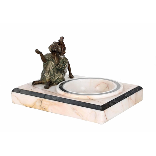 649 - In the manner of Franz Bergmann - a bronze figural group on an onyx base, modelled with an Arab gent... 