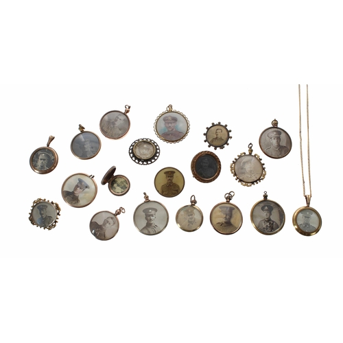 662 - Group of nineteen WWI/WWII photograph brooches and pendants, some with images to both sides and some... 