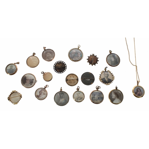 662 - Group of nineteen WWI/WWII photograph brooches and pendants, some with images to both sides and some... 