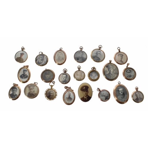 663 - Group of twenty-one WWI/WWII photograph brooches and pendants, some with images to both sides and so... 