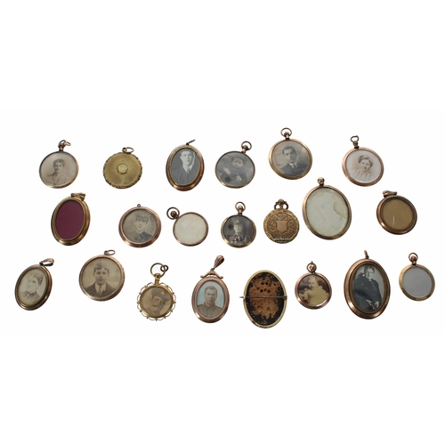 663 - Group of twenty-one WWI/WWII photograph brooches and pendants, some with images to both sides and so... 