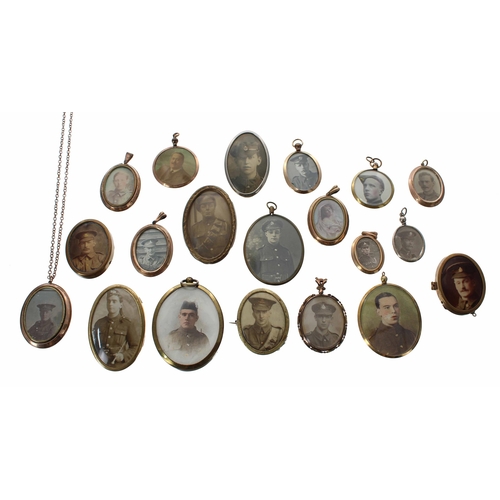 664 - Group of twenty WWI/WWII photograph brooches, pendants and framed miniatures, some with images to bo... 