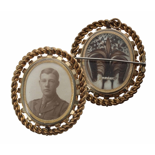 669 - Good large swivel photograph mourning brooch, bearing the portrait of a uniformed officer opposite l... 