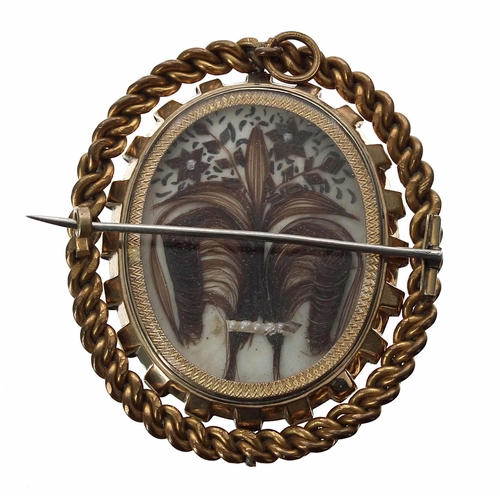 669 - Good large swivel photograph mourning brooch, bearing the portrait of a uniformed officer opposite l... 