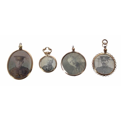 670 - Four 9ct double sided photograph pendants, featuring portraits of uniformed officers, one with full ... 