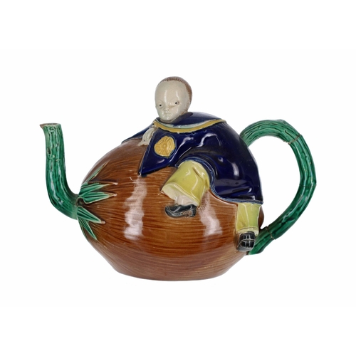 714 - 19th century majolica glazed teapot and cover in the manner of Joseph Holdcroft, modelled as a boy c... 