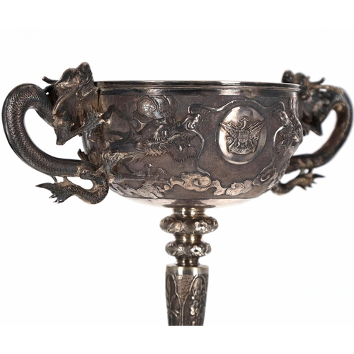 743 - Late 19th/early 20th century Chinese export white metal twin-handled pedestal goblet, with repousse ... 