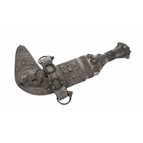 768 - 19th century Arab Omani Child's ceremonial white metal mounted Jambiya, the handle and leather-backe... 