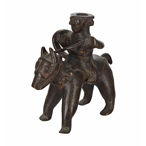 773 - African bronze taper stick holder modelled as a figure on horseback, 4.75