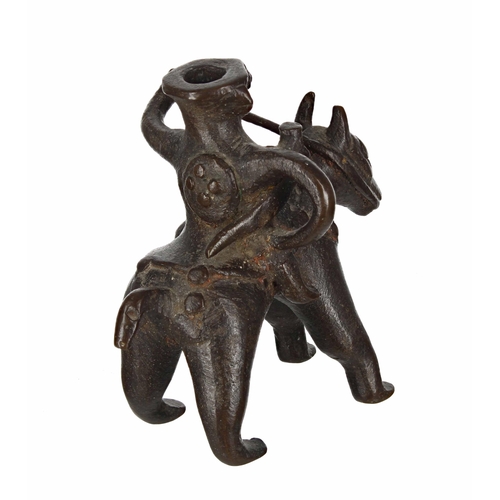 773 - African bronze taper stick holder modelled as a figure on horseback, 4.75