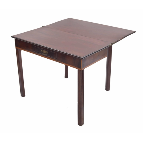 961 - Georgian mahogany fold-over tea table, the rectangular hinged top over a small frieze drawer, raised... 