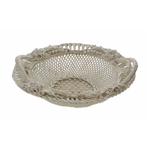 716 - Belleek circular porcelain basket, with twin naturalistic handles and applied flowers around the rim... 