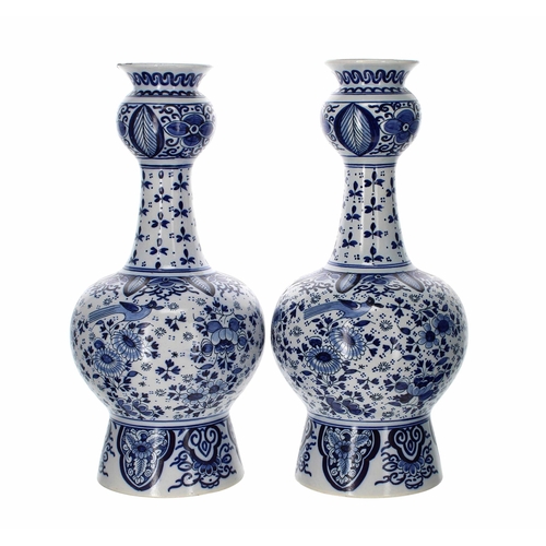 721 - Pair of Dutch Faience glazed double gourd blue and white pottery vases, decorated with birds amongst... 